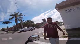 Close Call: Motorcyclist Avoids Collision With Pedestrian While Crossing