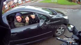 Close Call: Motorcyclist Almost Hit by a Vehicle Pulling Out at a Turn