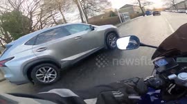 Close Call: Silver Car Pulls Out Towards Motorcyclist Without Checking Lanes