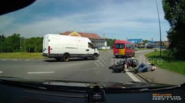 Accident: Motorcyclist Gets Knocked Down by Red Van