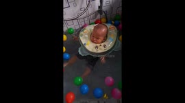 Expression of a 7 Month Old Baby Swim in a Pool in Padang, West Sumatra. Indonesia