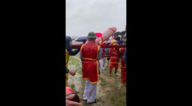 Vietnamese festival sees giant wooden penises paraded through rice fields