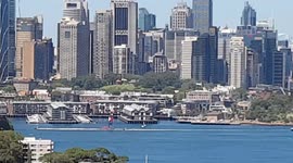 Unique video of SailGP Canada super yacht sailing across Sydney harbour and panoramic city background