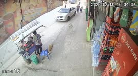 Street vendor dodges out-of-control pickup truck that flattens her stall