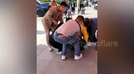 Kind-hearted people rescue motorist trapped in Tesla after it smashes into bus in China