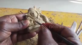 Miniature artist from eastern India makes Shiva idol inside glass bottle