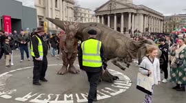 Growling dinosaurs thrill crowds in London's Trafalgar Square