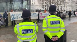 Protest 'Raise The Alarm!' at New Scotland Yard organized by the Copwatch Network