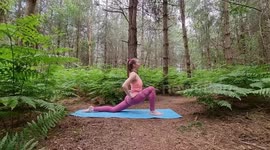Yoga in nature, surrounded trees, flowers fresh air