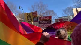Parasol Protectors Outside a Drag Story Hour Chant to Drown Out Proud Boys