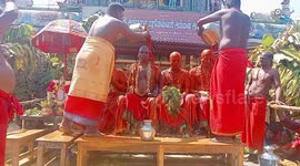 Devotees cover themselves in chilli powder and milk during bizarre ritual in India