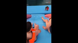 Mom & son's water slide adventure ends on a sloppy note