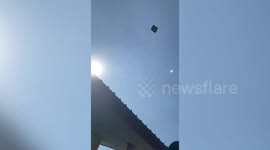 It's a UFO! Hilarious moment mystery flying tent lands in family's back garden