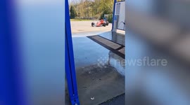 Formula 1 car visits drive-thru car wash in France