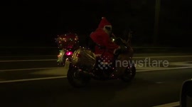 Biker Santa speeds down UK motorway