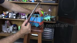 Dad sets up pedal powered Thomas the Tank Engine to play Jingle Bells Christmas morning