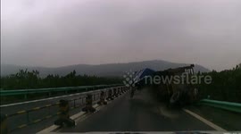 Spectacular truck crash as wheel axle collapses in China