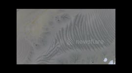 Drone captures intricate patterns in winter ice from above