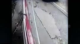 Man's miracle escape from falling billboard in China