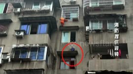Fireman rescues boy trapped on 5th-floor platform