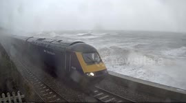 Train hit by waves amid Storm Frank in UK