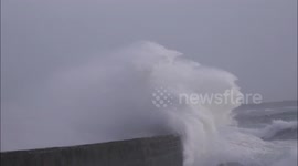 Storm Frank waves cover Isle of Man lighthouse