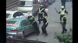 Four officers injured as cops chase runaway driver in China