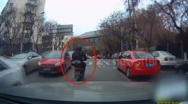 Motorcyclist kicks over pedestrian as he drives over crossing