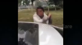 Woman smashes ex-boyfriend's car with hammer in China