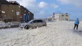 Walking through sea foam blizzard in France