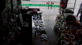 Version 2 - Man's miracle escape from falling billboard in China