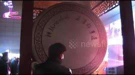 Thousand people queue to hit huge drum on Christmas Eve