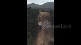 Footage of SUV climbing near-vertical slope