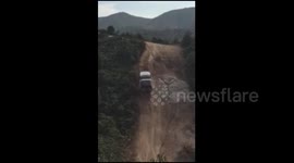 Footage of SUV climbing near-vertical slope