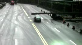 This driver thought her car would fit under these metal bars...