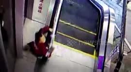 Boy just rescued in time after his head got trapped under escalator handrail