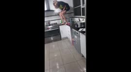 Australian man films girlfriend trapped in kitchen by BIG spider