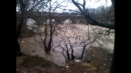 More footage of a bridge above the swelling River Don in Scotland
