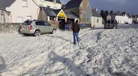 sea foam blizzard in Brittany, France.