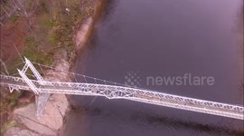 Drone footage of historic suspension bridge damaged by British storms
