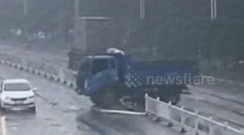 Truck spins out on slippery road in attempt to avoid scooter