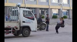 Teenager pulls truck with basin sucked on belly