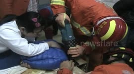 Youngster gets head stuck in the hole of a massage table