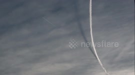 The shadow of contrails in the sky