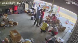 Pickup truck crashes into parked cars in front of shocked workers
