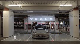 Tesla replenishes battery at charging point in Bangkok, Thailand