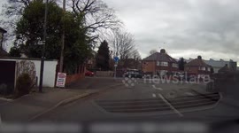 Elderly driver confusingly cuts up other driver on mini roundabout, Derbyshire, UK