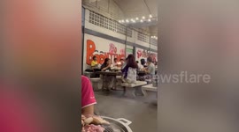 Frantic students put out barbecue fire with cup of drink