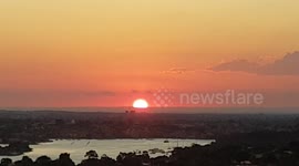Orange Sunset close up dropping over horizon