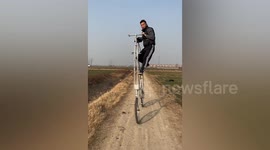 Talented man rides 3-metre-high bike he made himself